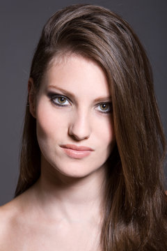 Beautiful young woman with slong long hair and gorgeous skin