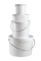 Four closed white plastic containers one on the another
