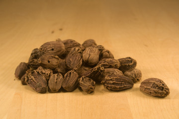 Black cardamom fruits on burlap