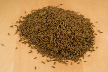 Cumin seeds on wood