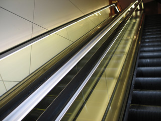a black escalator in a modern building