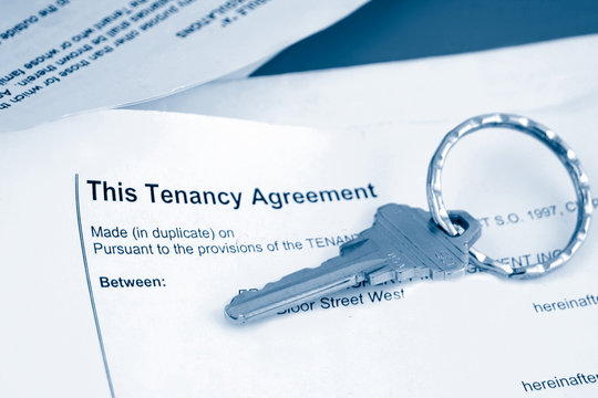 some paperwork concerning tenancy agreement with key