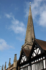 church tower behind black and white building