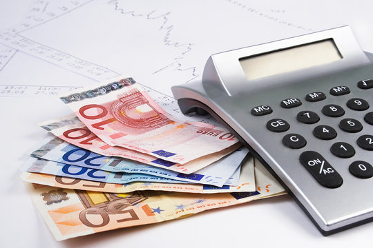 Business accessories euro money , calculator and diagrams