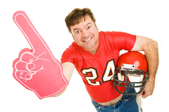 Middle aged football fan wearing his old high school jersey