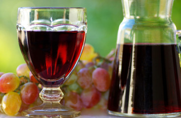 Red wine and grapes