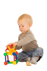 little boy play with toys. isolated on a white background
