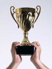 Trophy held above head with 2 hands