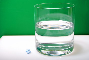 Water Glass and Blue Pills