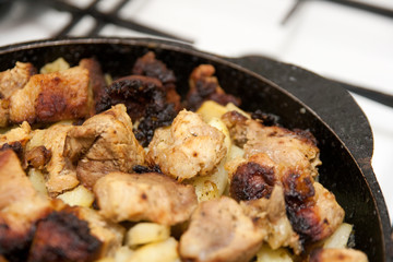 fried meat and potaton on the plate