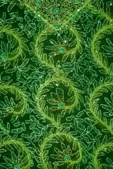 Naklejka na ściany i meble Robótki wzór liścia na zielonym suknem z cekinami