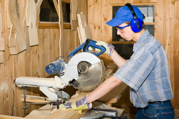 A carpenter(sawman) at work.