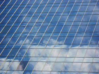 Modern building with cloud reflection.