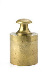 brass weight on white background
