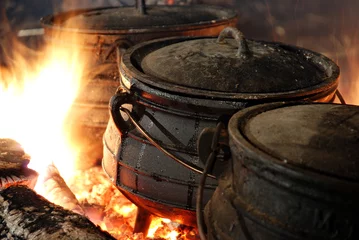 Fotobehang hot cauldron on a fire © niv koren