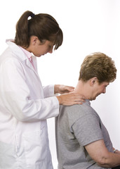 Fototapeta premium physical therapist checks a patient's spine in the neck
