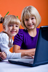 schoolgirls with the notebook surfing internet 1