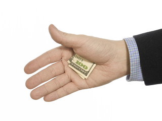A hand hiding a hundred dollars tip.