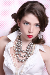 Beautiful Woman Dressed in Retro Vintage Style Wearing Pearls