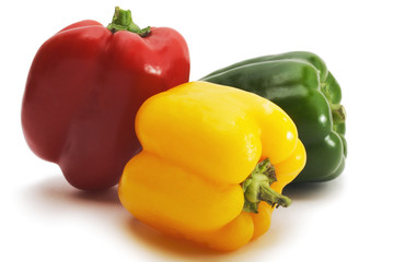 Three colored  paprika on white background