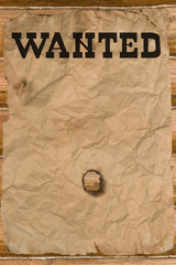 Wanted poster with a hole (vintage Wild West style)
