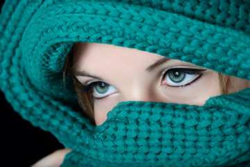 Young woman with black kohl make-up on eyes