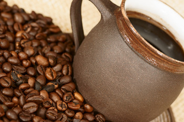 detail of coffee cup with coffee beans