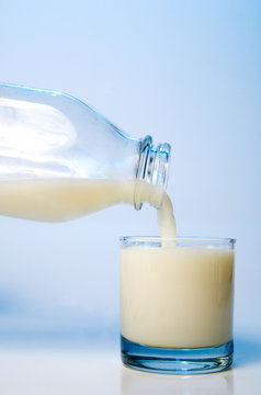 Pouring milk into a glass ready for consumption.