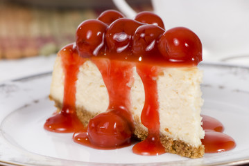 A delicious slice of cheesecake with fruit topping.