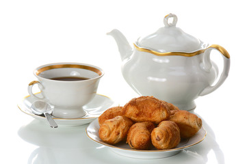 tea drinking with croissants on white