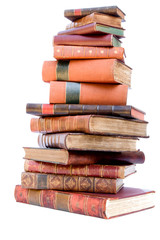 A pile of antique leather books isolated on a white background