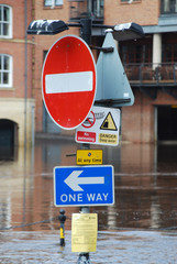 Flooded traffic sign on bank of River Ouse in York