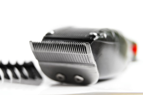 closeup of hair clippers and guide, on white