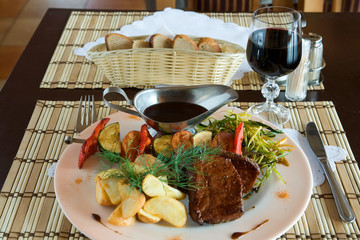 Steak and wine in hunting restaurant - 9515628