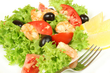 Shrimp salad. Seafood and vegetables. Delicious cuisine.