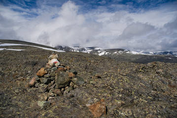 Jotunheimen landscape on sunny day with dramatic clouds
