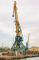 Fototapeta na wymiar Big crane in the city river port