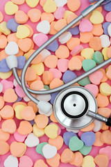Stethoscope with candy hearts – listening to what your heart