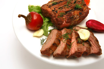 served roasted meat steak on color dish