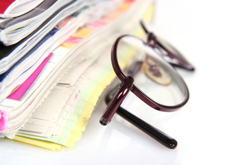 Eyeglasses and newspapers