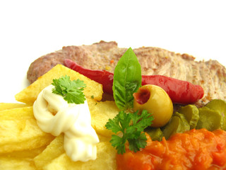 Dish meal with beef steak, French fries and dressing