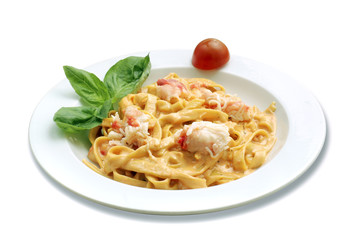 Italian pasta with crab. White isolated with path.