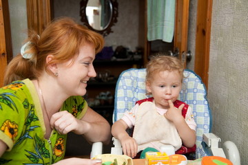 mother and baby eating