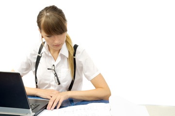 Young businesswoman looks through project, isolated on white