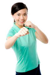 A young attractive Asian woman in green sports top