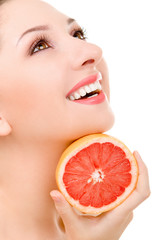 pretty woman with orange isolated on the white background