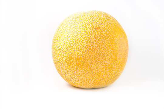 Ripe yellow melon with grid on a white background