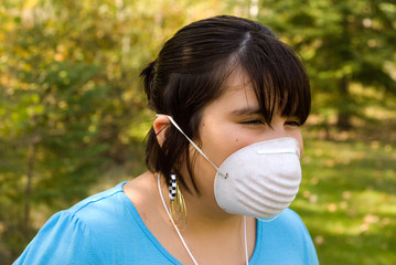 A young girl wearing a mask to protect herself from SARS