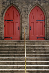 Church with double doors painted in red.