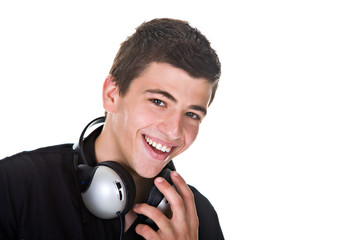 Portrait of a happy young man smiling, with headphones.